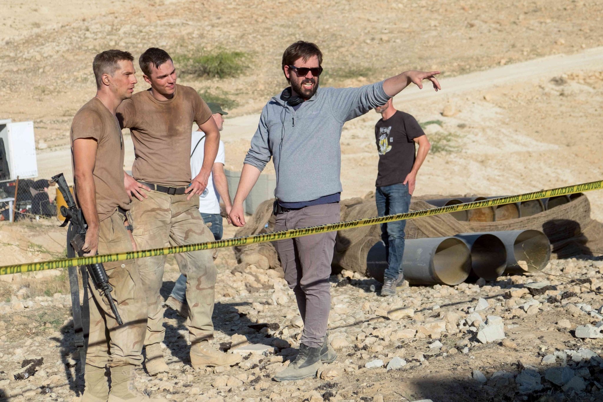Logan Marshall-Green, Nicholas Hoult, and Fernando Coimbra behind the scenes on the set of Netflix Original Film Sand Castle (2017). Photo courtesy of Nick Wall/Netflix. Copyright Nick Wall Photography.