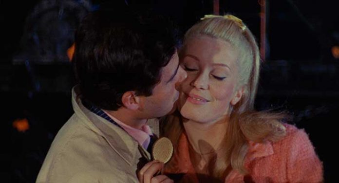 Left to right: Nino Castelnuovo and Catherine Deneuve in The Umbrellas of Cherbourg. Photo courtesy The Criterion Collection.