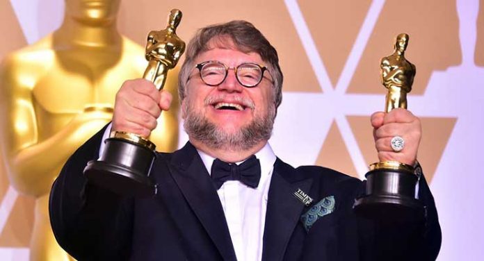 Director Guillermo del Toro poses in the press room with the Oscars for best picture and best director during the 90th Annual Academy Awards on March 4, 2018, in Hollywood, California. / AFP PHOTO / FREDERIC J. BROWN (Photo credit should read FREDERIC J. BROWN/AFP/Getty Images) AFP/Getty Images