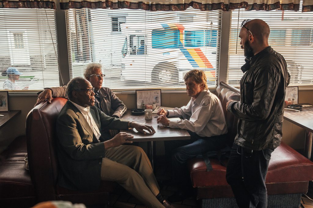 The Old Man & The Gun (From L-R): Danny Glover, Tom Waits, Robert Redford and Director David Lowery on the set of THE OLD MAN & THE GUN. Photo by Eric Zachanowich. © 2018 Twentieth Century Fox Film Corporation All Rights Reserved