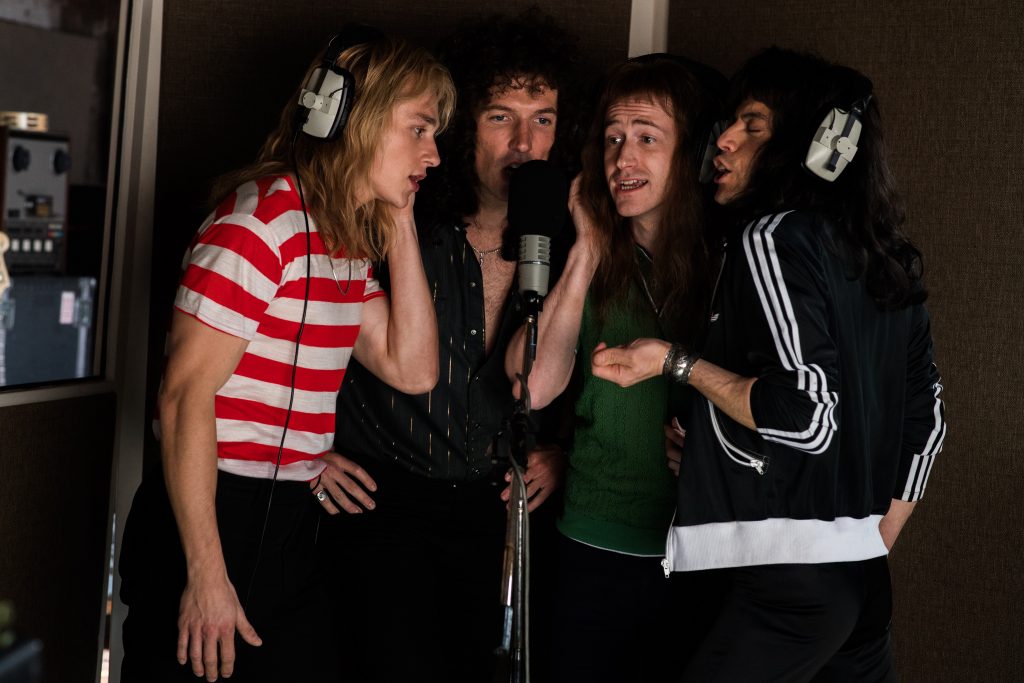 BOHEMIAN RHAPSODY L-R: Ben Hardy (Roger Taylor), Gwilym Lee (Brian May), Joe Mazzello (John Deacon), and Rami Malek (Freddie Mercury) star in Twentieth Century Fox’s BOHEMIAN RHAPSODY. Photo Credit: Alex Bailey.
