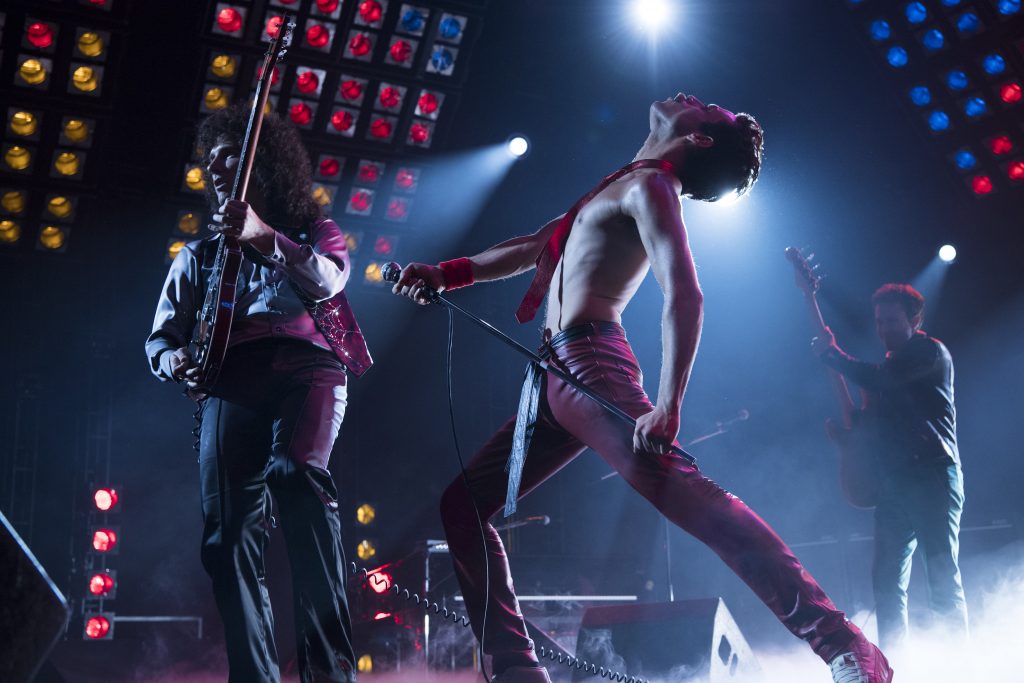 BOHEMIAN RHAPSODY L-R: Gwilym Lee (Brian May), Rami Malek (Freddie Mercury), and Joe Mazzello (John Deacon) star in Twentieth Century Fox’s BOHEMIAN RHAPSODY. Photo Credit: Courtesy Twentieth Century Fox.
