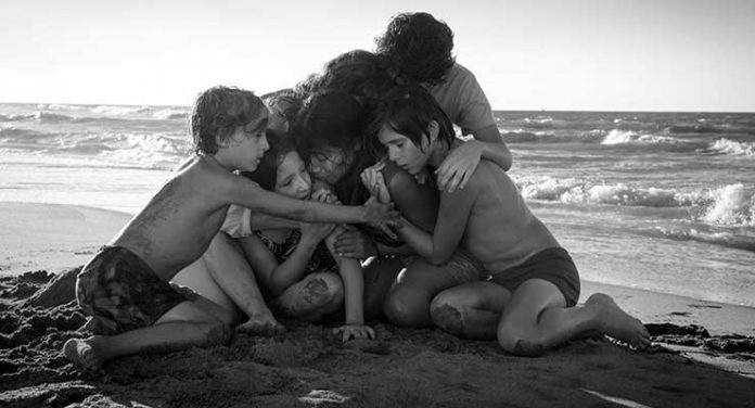 Yalitza Aparicio as Cleo, Marco Graf as Pepe, Carlos Peralta Jacobson as Paco, and Daniela Demesa as Sofi in Roma, written and directed by Alfonso Cuarón. Image by Alfonso Cuarón.