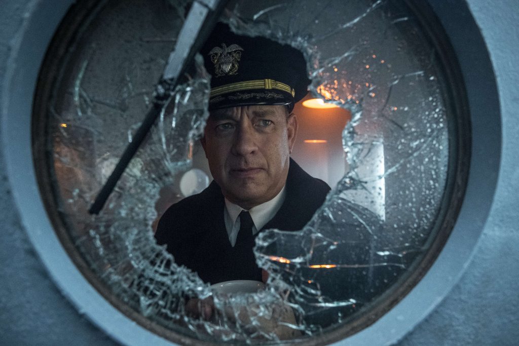 Capt Krause (TOM HANKS) peers out the broken pilot house window in TriStar Pictures' GREYHOUND.
