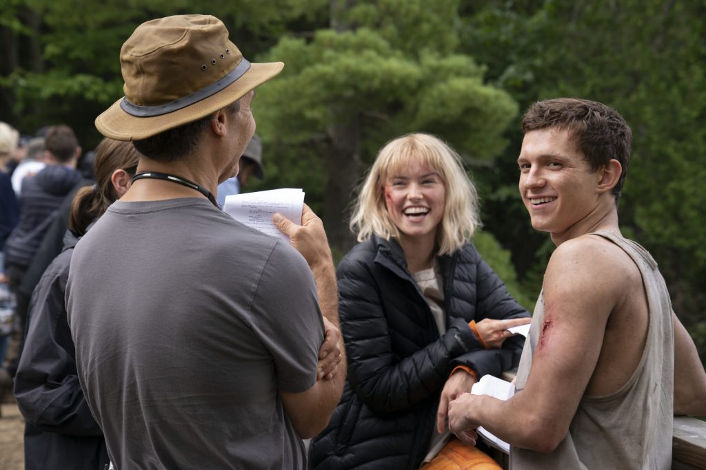 Director Doug Liman, Daisy Ridley, and Tom Holland on the set of CHAOS WALKING. Photo Credit: Murray Close