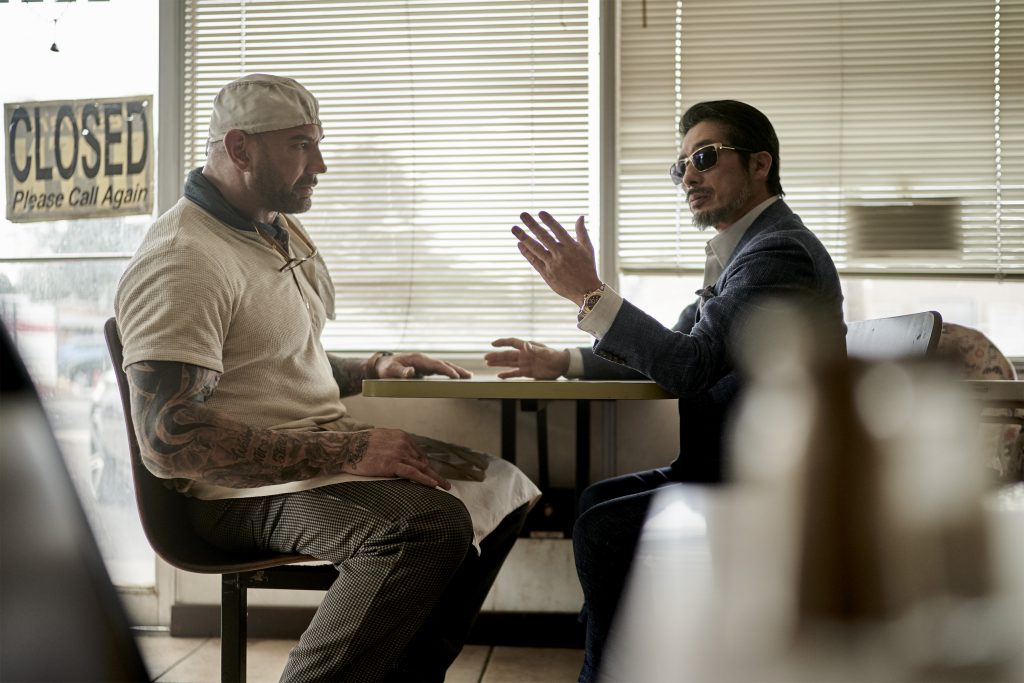 ARMY OF THE DEAD (L to R) Dave Bautista as Scott Ward, HIROYUKI SANADA as TANAKA in ARMY OF THE DEAD. Cr. CLAY ENOS/NETFLIX © 2021