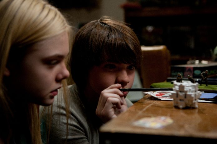 Elle Fanning and Joel Courtney in Super 8 (2011)