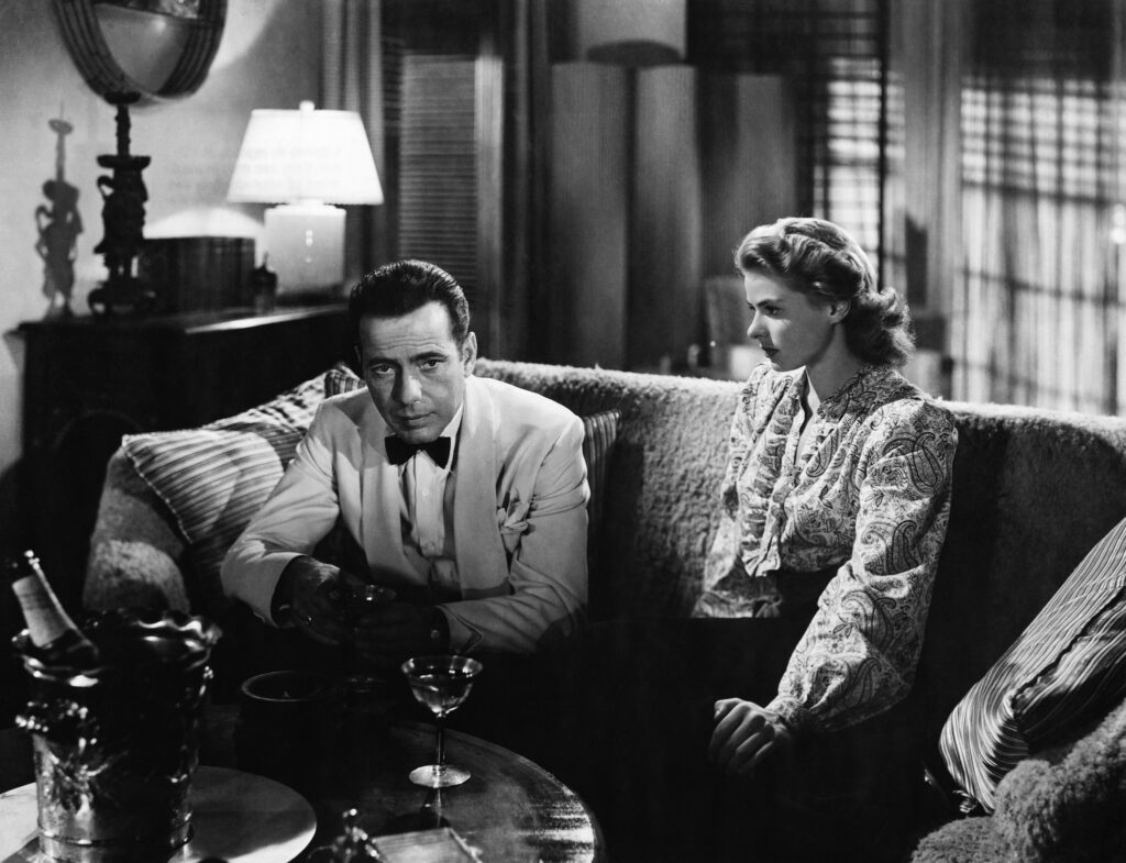 1942: Movie still from the 1942 classic, "Casablanca." In this scene, Humphrey Bogart and Ingrid Bergman reminisce about Paris on a couch. (Photo by �� John Springer Collection/CORBIS/Corbis via Getty Images)