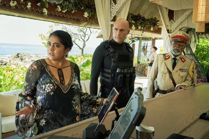 uhoo Verma as Saira, Mark Strong as Miller and John Kani as Colonel Ulenga in Murder Mystery 2. Cr. Scott Yamano/Netflix © 2023.