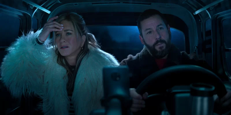 (L to R) Jennifer Aniston as Audrey Spitz and Adam Sandler as Nick Spitz in Murder Mystery 2. Cr. Courtesy of Netflix © 2023.