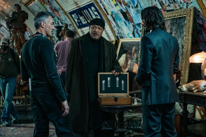 Chad Stahelski - Director, Laurence Fishburne as Bowery King, and Keanu Reeves as John Wick in John Wick: Chapter 4. Photo Credit: Murray Close