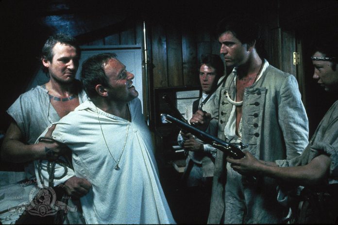 Mel Gibson, Anthony Hopkins, Liam Neeson, Dexter Fletcher, and Phil Davis in The Bounty (1984)