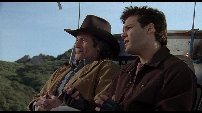 Chris Gartin and Fred Ward in Tremors II: Aftershocks (1996)