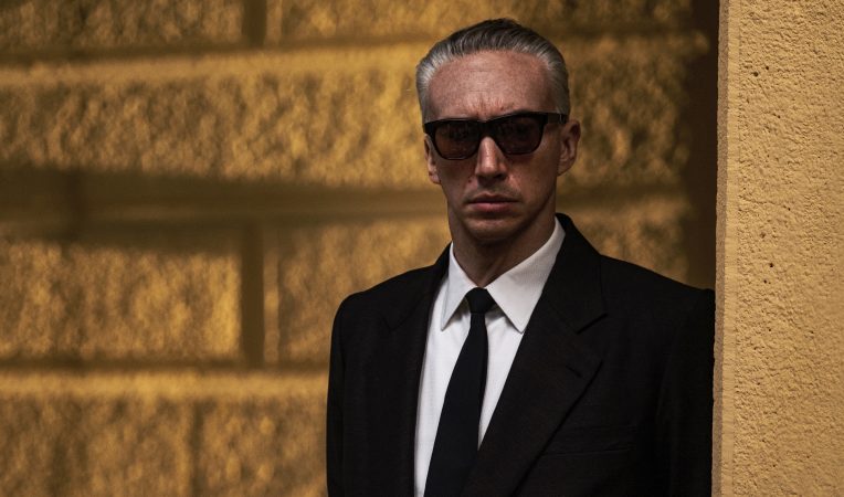 Adam Driver as Enzo Ferrari on set in Modena, Italy -- Photo credit Lorenzo Sisti